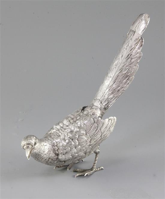 A German naturalistically cast 800 standard silver model of a standing magpie, Ludwig Neresheimer, Hanau, height 23cm.